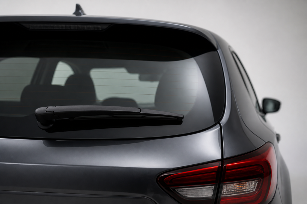 Rear window wiper blade mounted on a hatchback rear glass